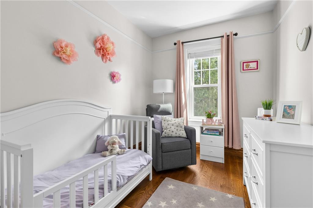 552 77th Street Brooklyn, NY 11209 - Photo 8 of 14 a bedroom with furniture and a window