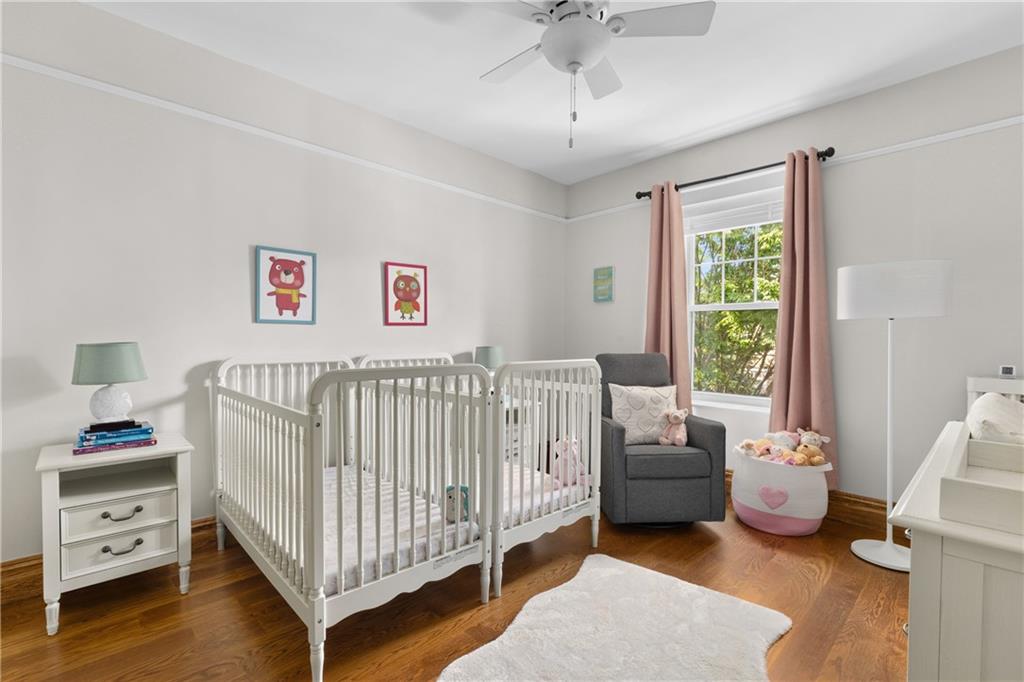 552 77th Street Brooklyn, NY 11209 - Photo 9 of 14 a bedroom with a bed and a window