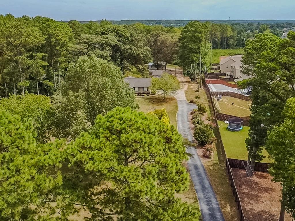 1152 Harbins Road Dacula, GA 30019 - Photo 10 of 33 a view of a lake with a houses