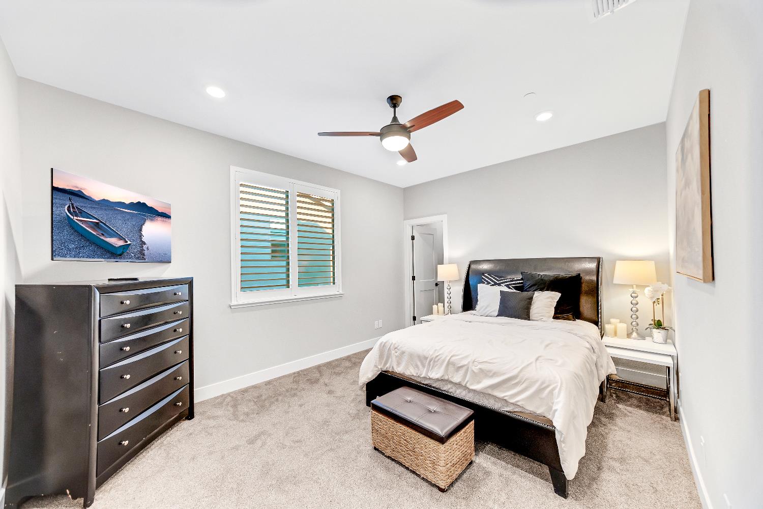 2947 Laredo Drive Rocklin, CA 95765 - Photo 31 of 65 a bedroom with a bed chandelier and a window