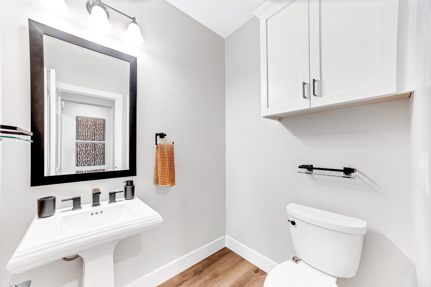 2947 Laredo Drive Rocklin, CA 95765 - Photo 37 of 65 a bathroom with a toilet sink and mirror