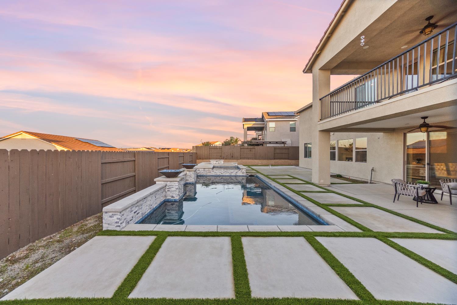 2947 Laredo Drive Rocklin, CA 95765 - Photo 57 of 65 a view of a patio with swimming pool table and chairs