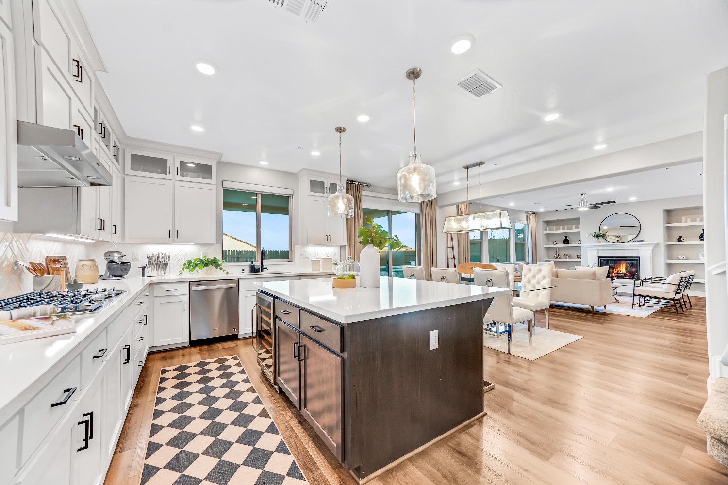 2947 Laredo Drive Rocklin, CA 95765 - Photo 7 of 65 a open kitchen with stainless steel appliances kitchen island granite countertop a stove and a view of living room