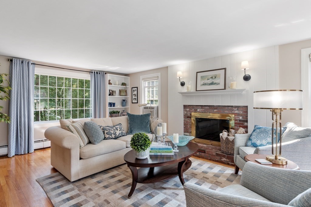 21 Oneida Road Acton, MA 01720 - Photo 13 of 39 a living room with furniture and a fireplace
