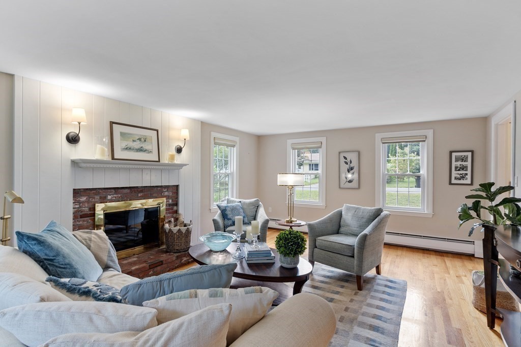 21 Oneida Road Acton, MA 01720 - Photo 14 of 39 a living room with furniture and a fireplace