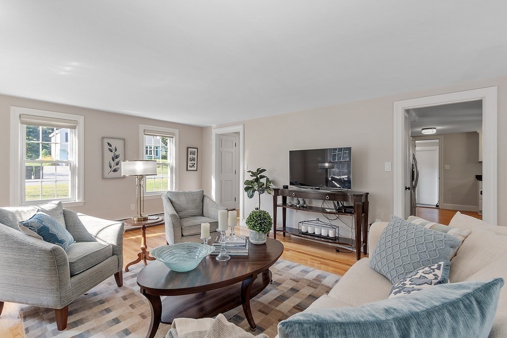 21 Oneida Road Acton, MA 01720 - Photo 15 of 39 a living room with furniture and a flat screen tv