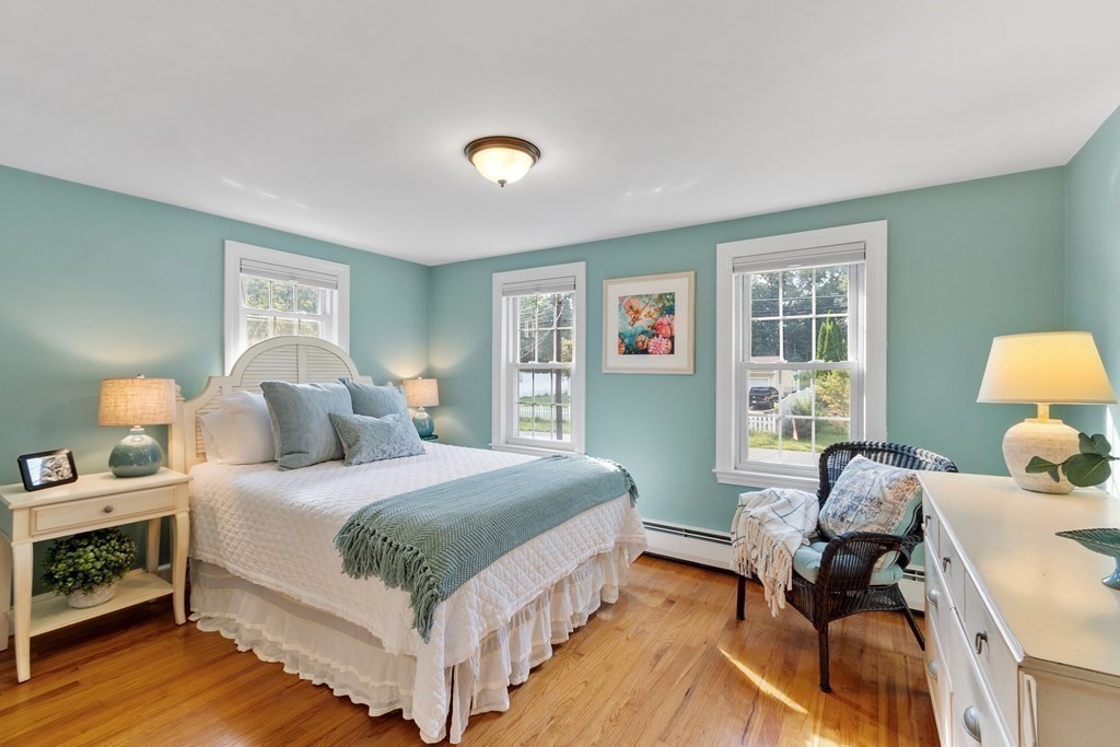 21 Oneida Road Acton, MA 01720 - Photo 21 of 39 a bedroom with a bed and wooden floor