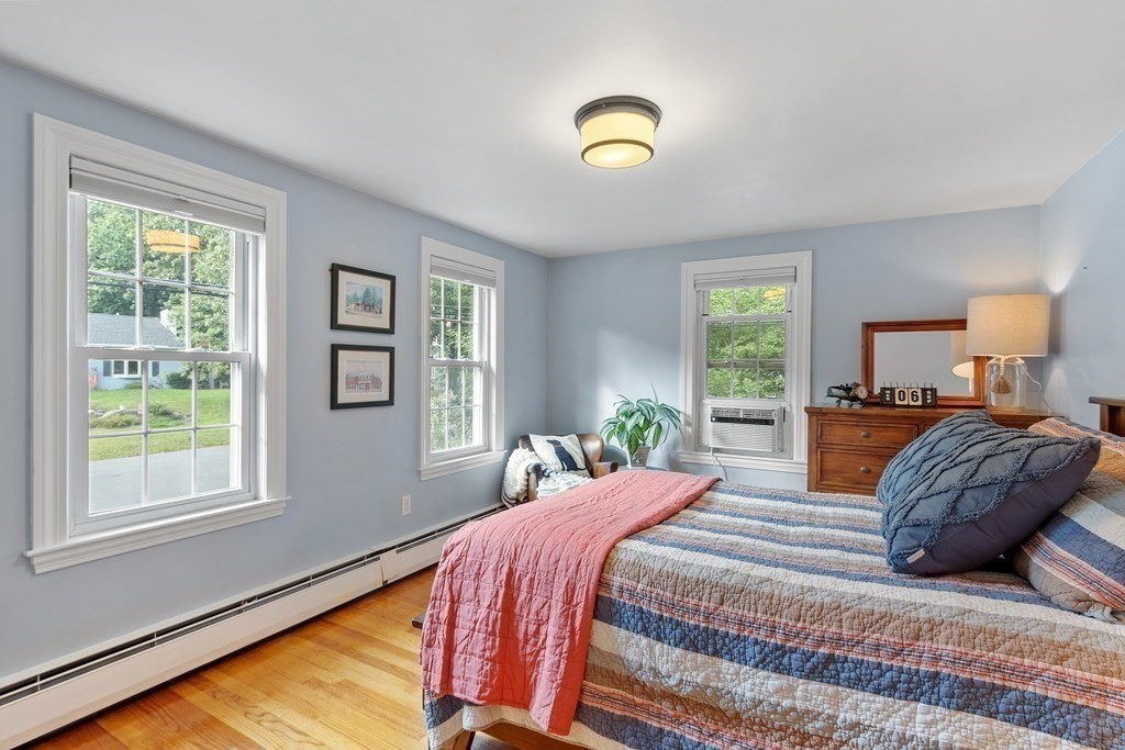 21 Oneida Road Acton, MA 01720 - Photo 27 of 39 a bedroom with a large bed and a window