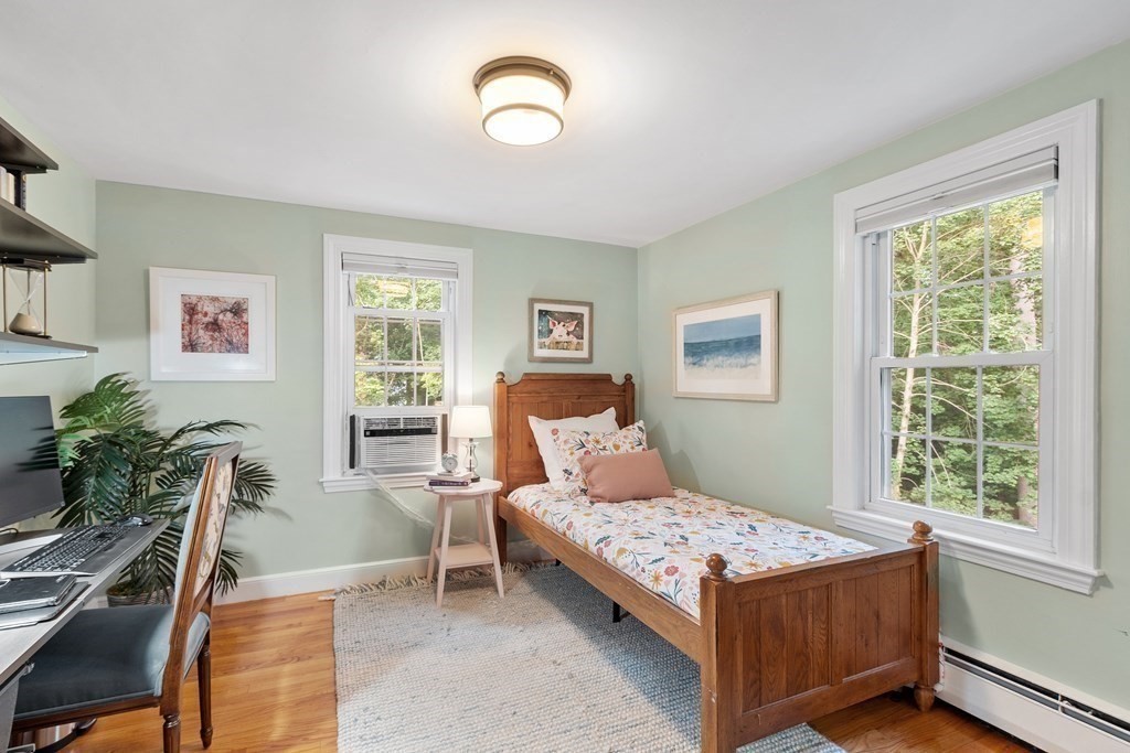 21 Oneida Road Acton, MA 01720 - Photo 29 of 39 a bedroom with a large bed and a window