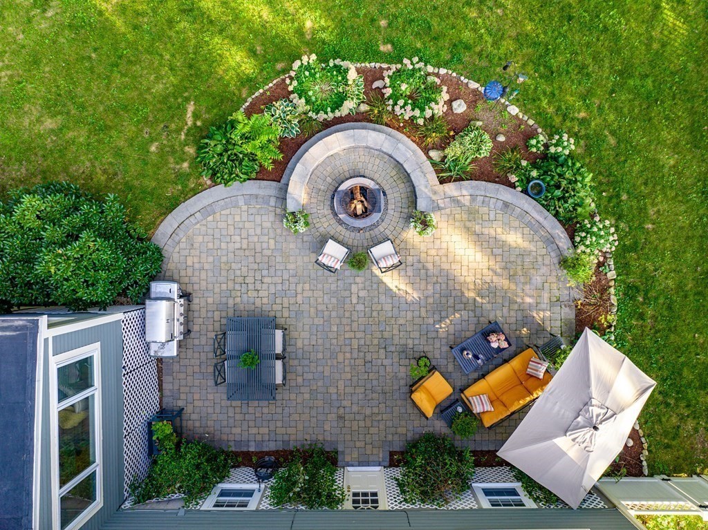 21 Oneida Road Acton, MA 01720 - Photo 4 of 39 an aerial view of a house with a garden and outdoor seating