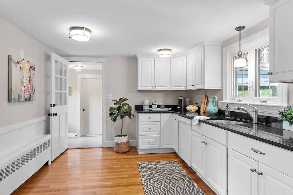 21 Oneida Road Acton, MA 01720 - Photo 8 of 39 a kitchen with a sink and cabinets