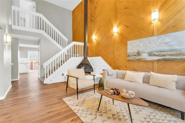 a view of a livingroom with furniture and wooden floor