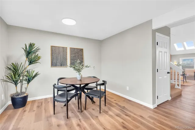 a view of a livingroom with furniture and a potted plant