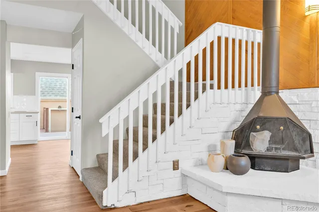 a view of entryway and hall with wooden floor