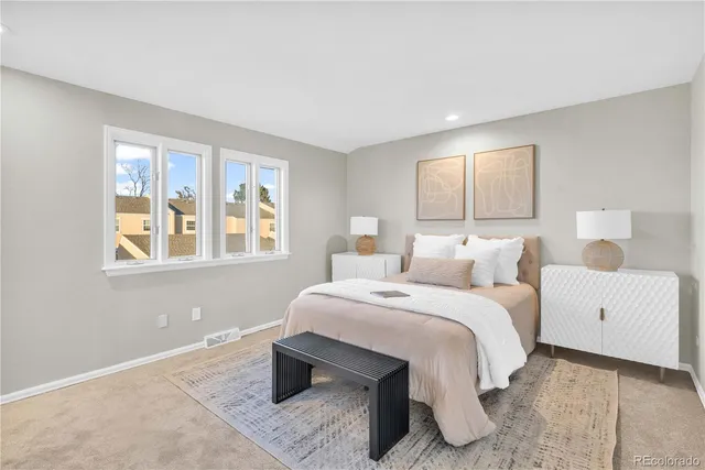 a bed room with a bed and a couch