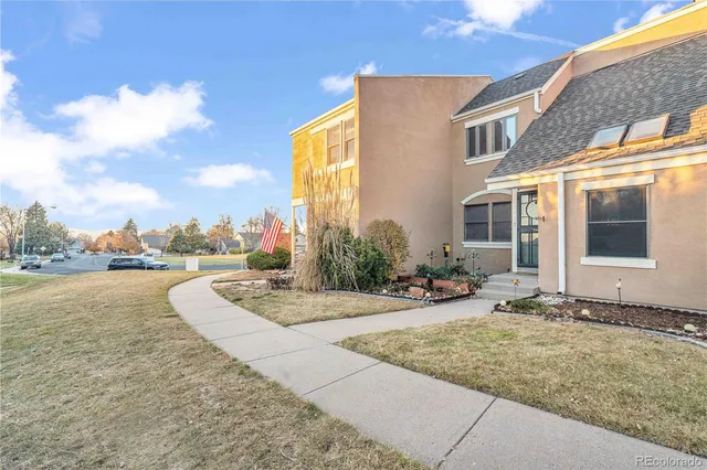 a view of a house with lounge chair and floor to ceiling window