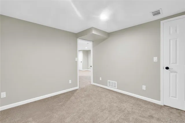 an empty room with an entryway