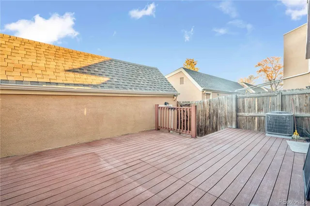 a view of a balcony with wooden floor