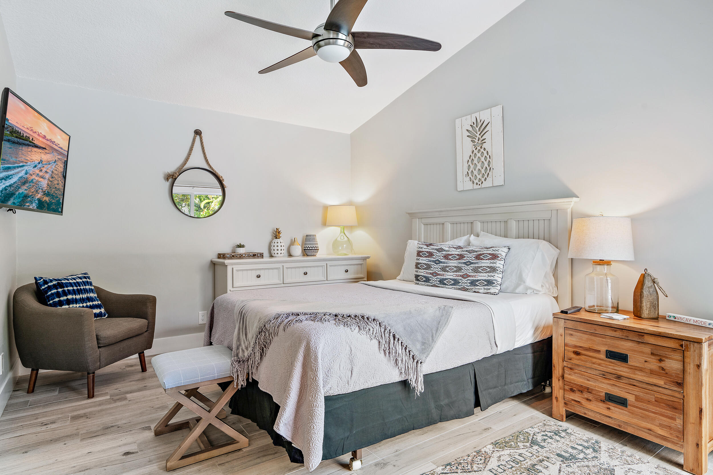 6219 Linton Street Jupiter, FL 33458 - Photo 12 of 41 a bedroom with a bed a desk and chair with wooden floor