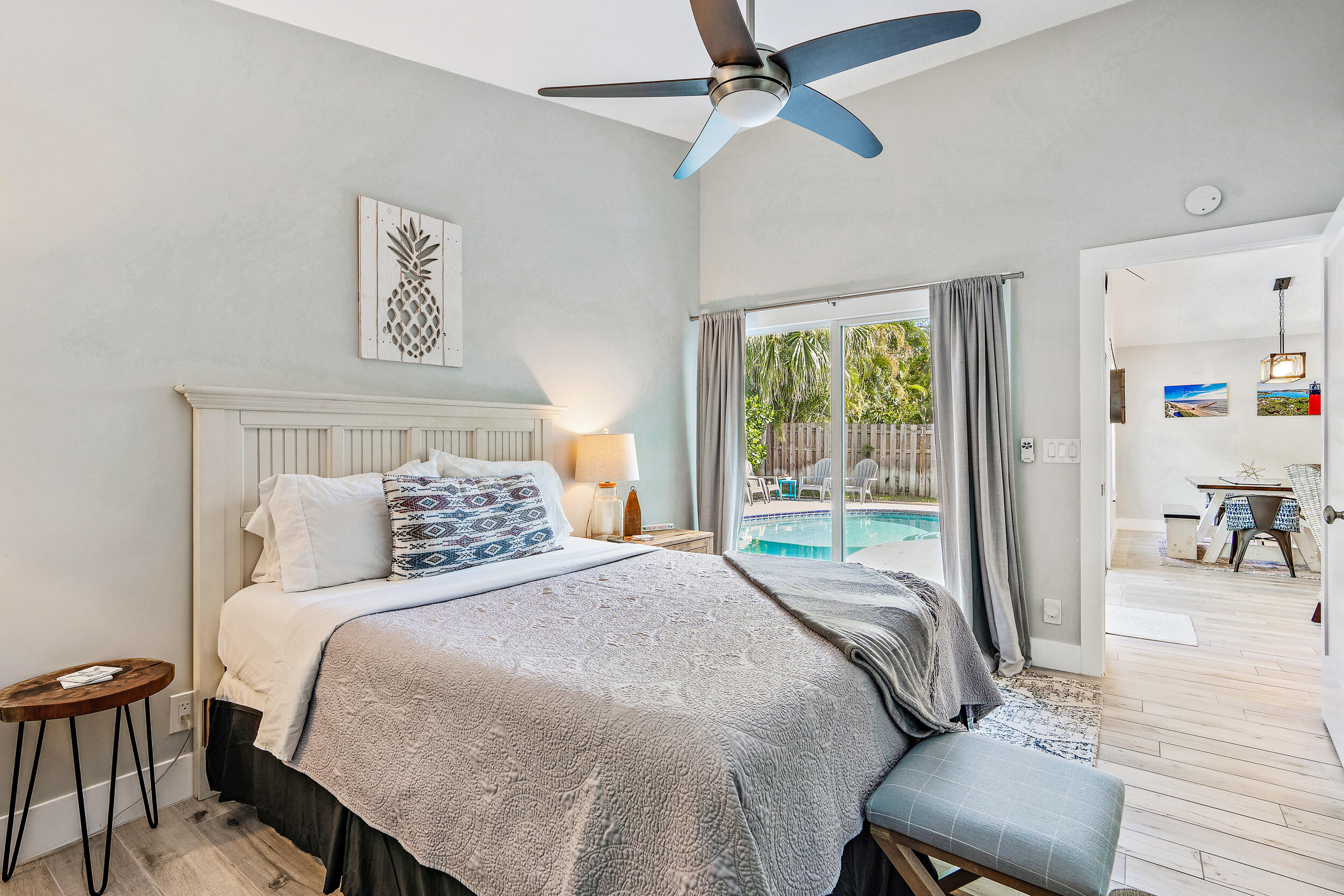 6219 Linton Street Jupiter, FL 33458 - Photo 13 of 41 a bedroom with a bed and a chair