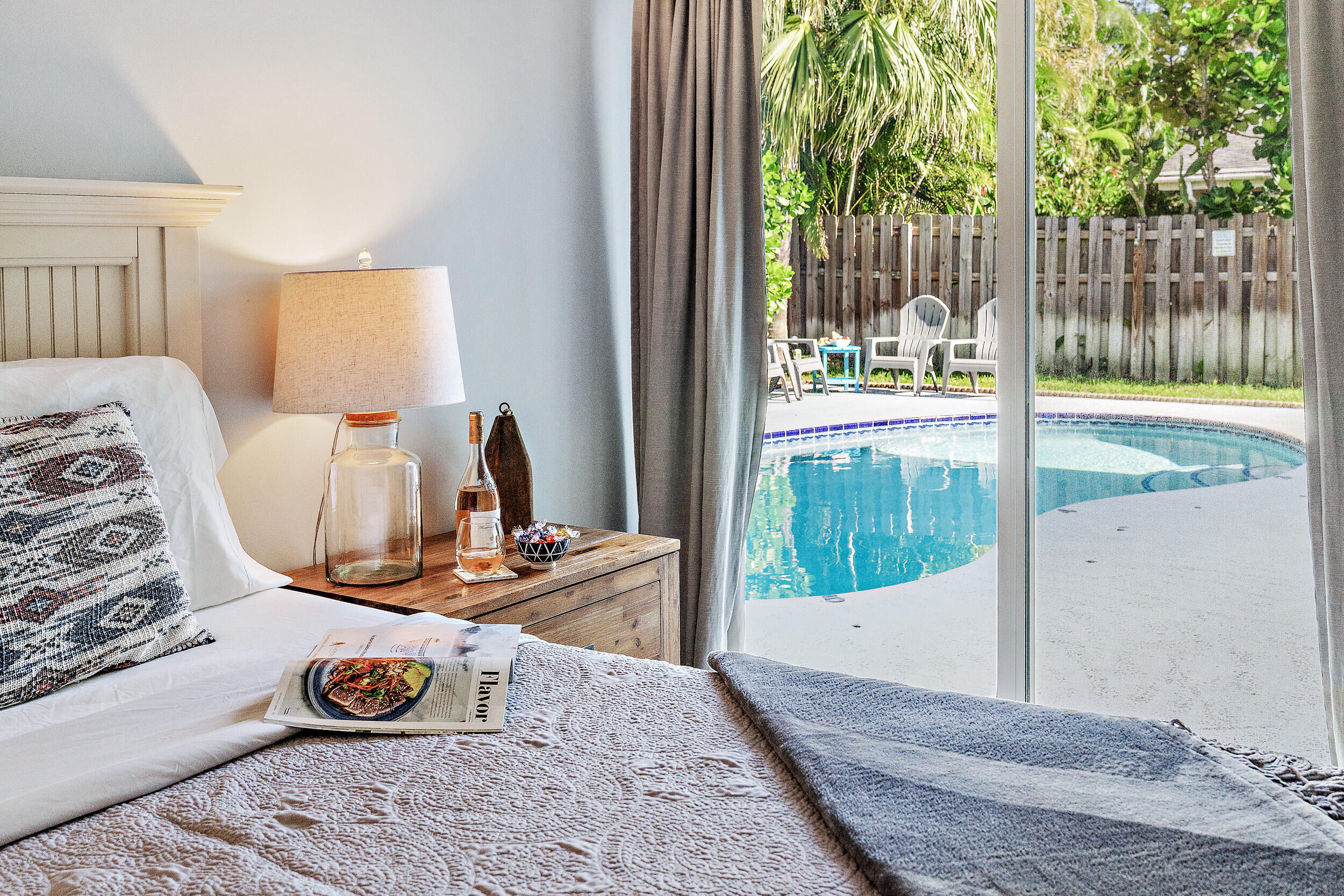 6219 Linton Street Jupiter, FL 33458 - Photo 14 of 41 a view of a bedroom with wooden floor and bed