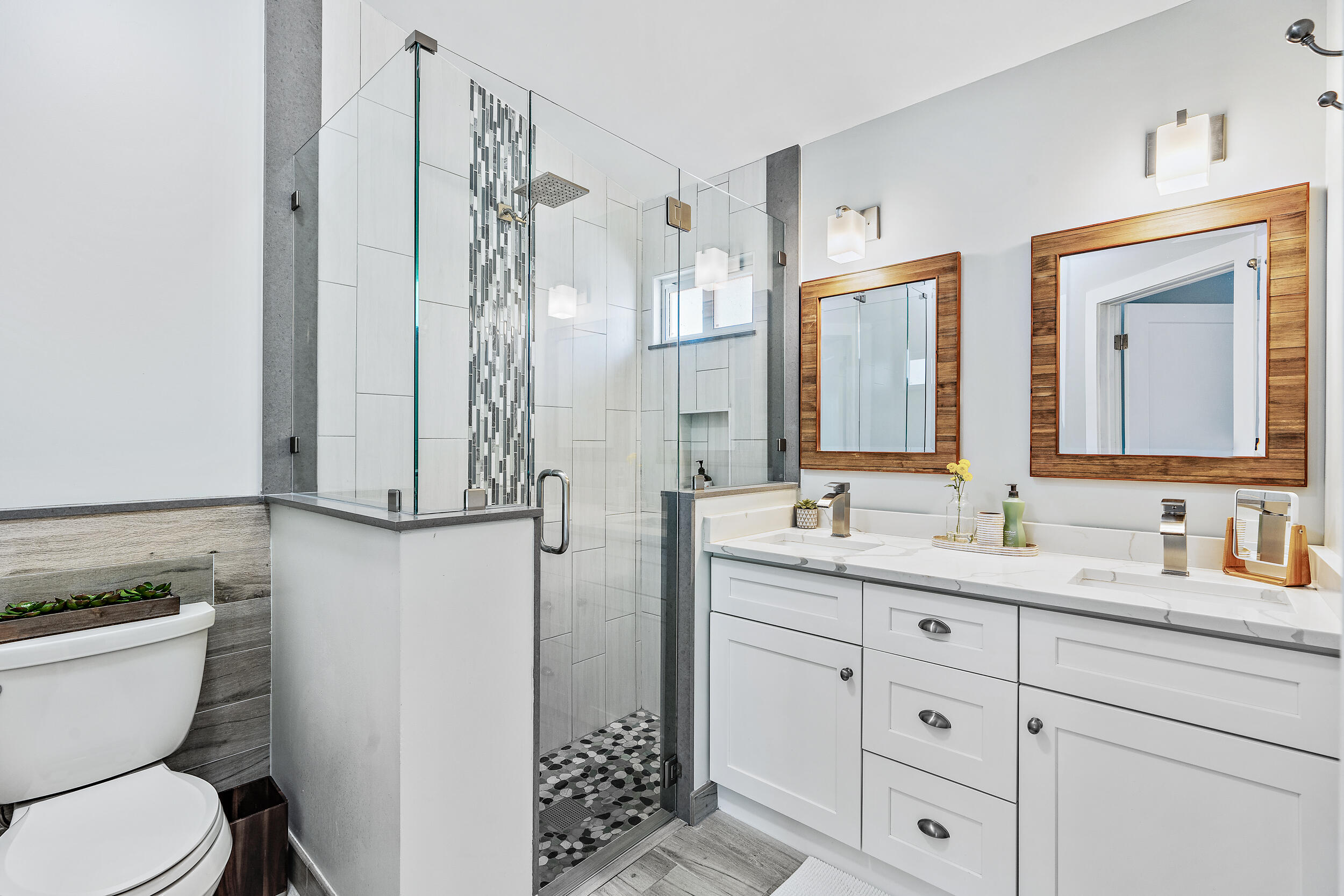 6219 Linton Street Jupiter, FL 33458 - Photo 15 of 41 a bathroom with a granite countertop sink toilet and mirror