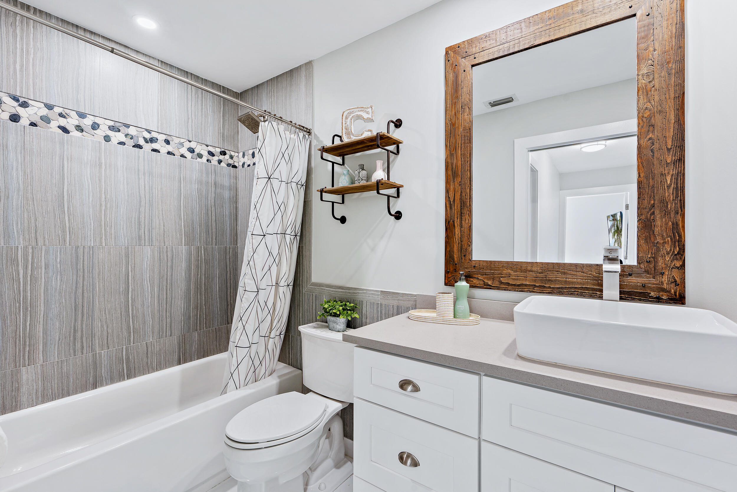 6219 Linton Street Jupiter, FL 33458 - Photo 17 of 41 a bathroom with a sink a toilet and shower