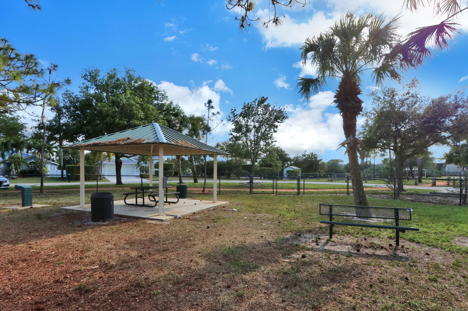 6219 Linton Street Jupiter, FL 33458 - Photo 25 of 41 a view of a park with swings and slides