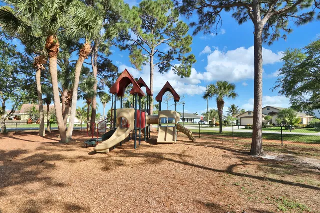 a view of a park with swings and slides