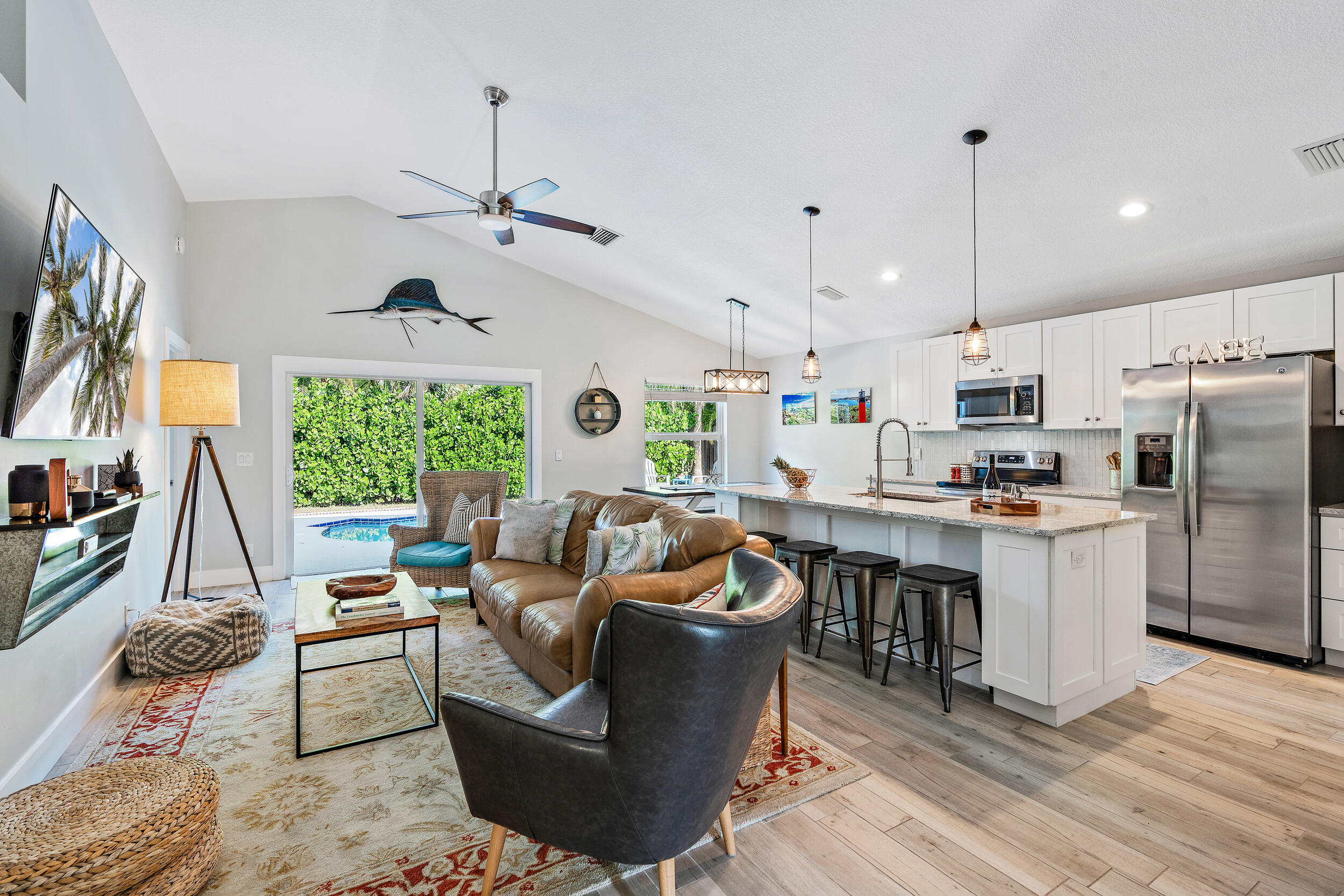 6219 Linton Street Jupiter, FL 33458 - Photo 5 of 41 a living room with furniture kitchen and a large window