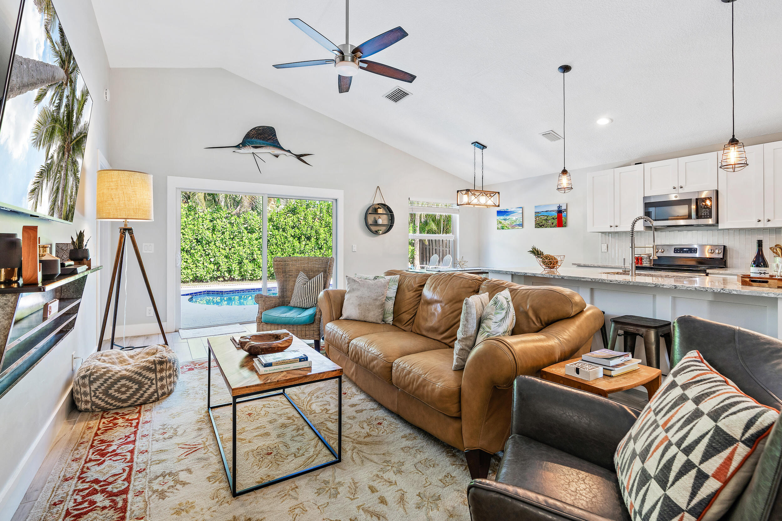 6219 Linton Street Jupiter, FL 33458 - Photo 6 of 41 a living room with furniture and a large window