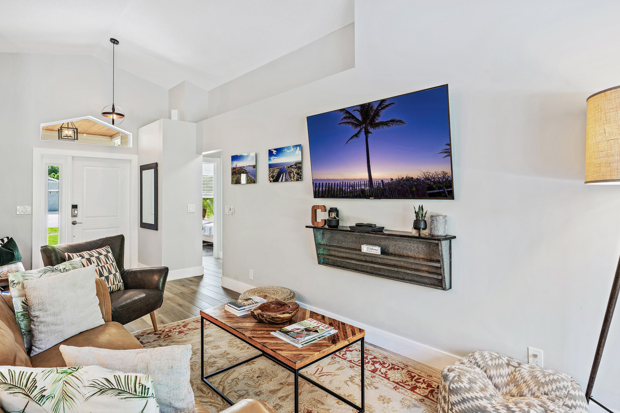 6219 Linton Street Jupiter, FL 33458 - Photo 7 of 41 a living room with furniture and a flat screen tv