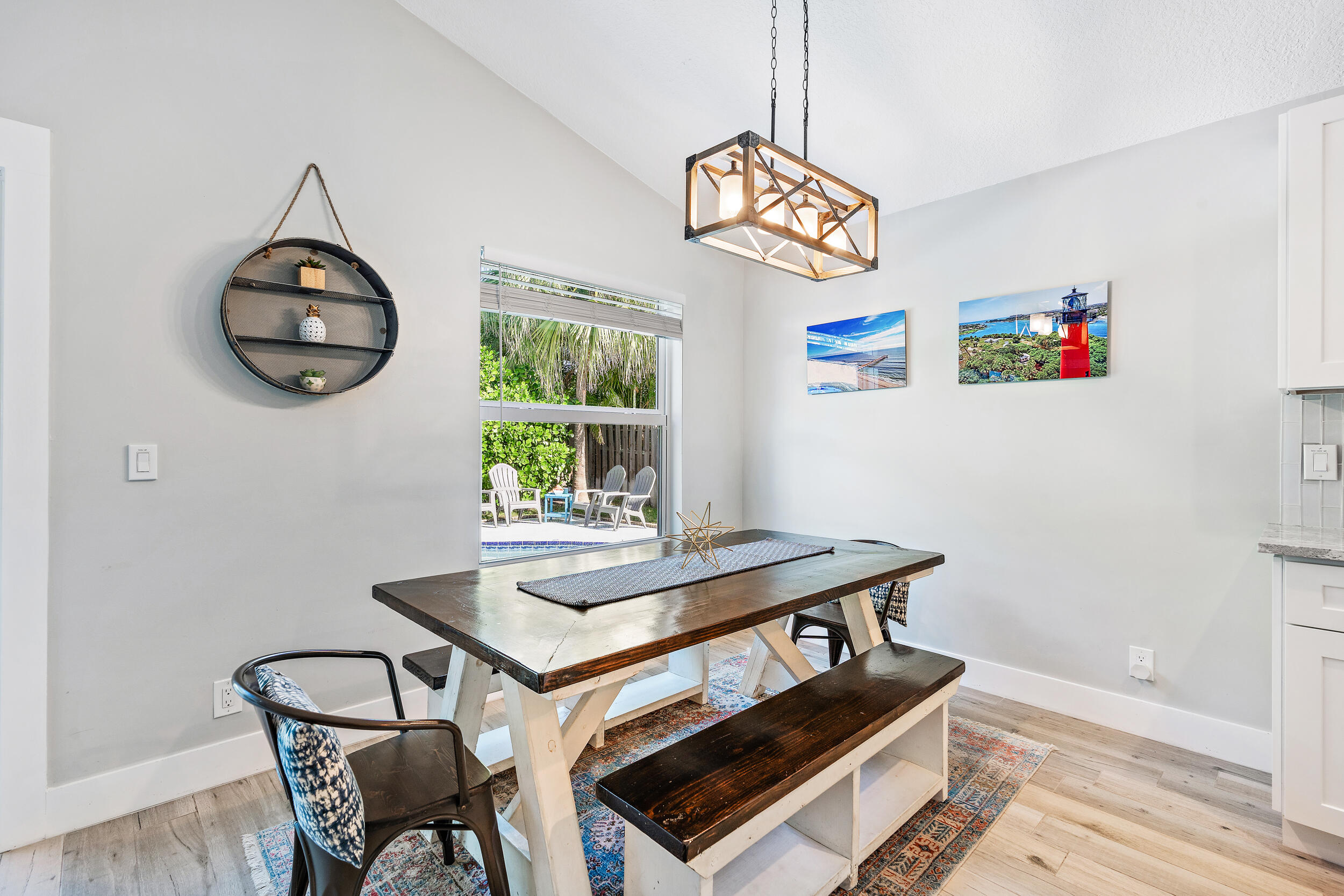 6219 Linton Street Jupiter, FL 33458 - Photo 8 of 41 a view of a dining room with furniture wooden floor and a window