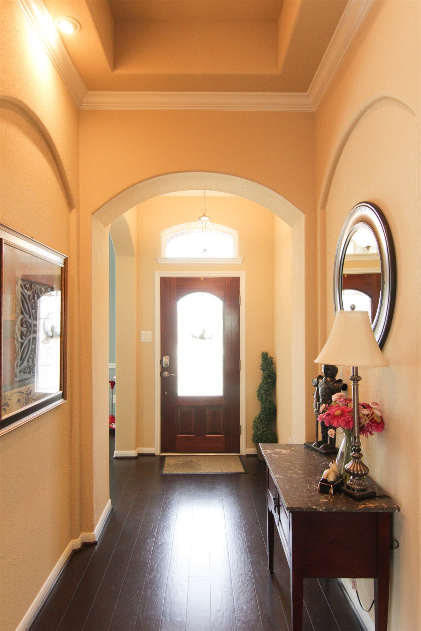 1423 Ralston Branch Way Sugar Land, TX 77479 - Photo 2 of 43 elegant foyer with tray ceiling; leaded glass front door; crown molding, arches & art niches throughout