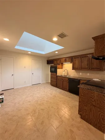 a view of a livingroom with an empty space and a fireplace