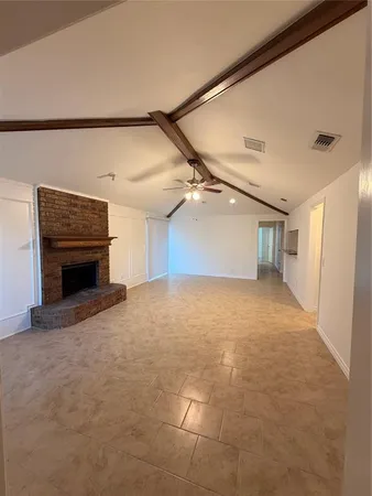 a view of a room with window and ceiling fan