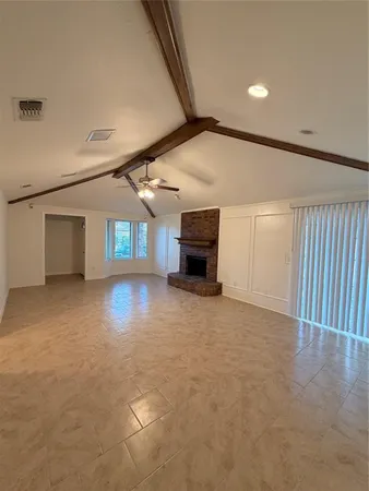 a view of livingroom with furniture and a window