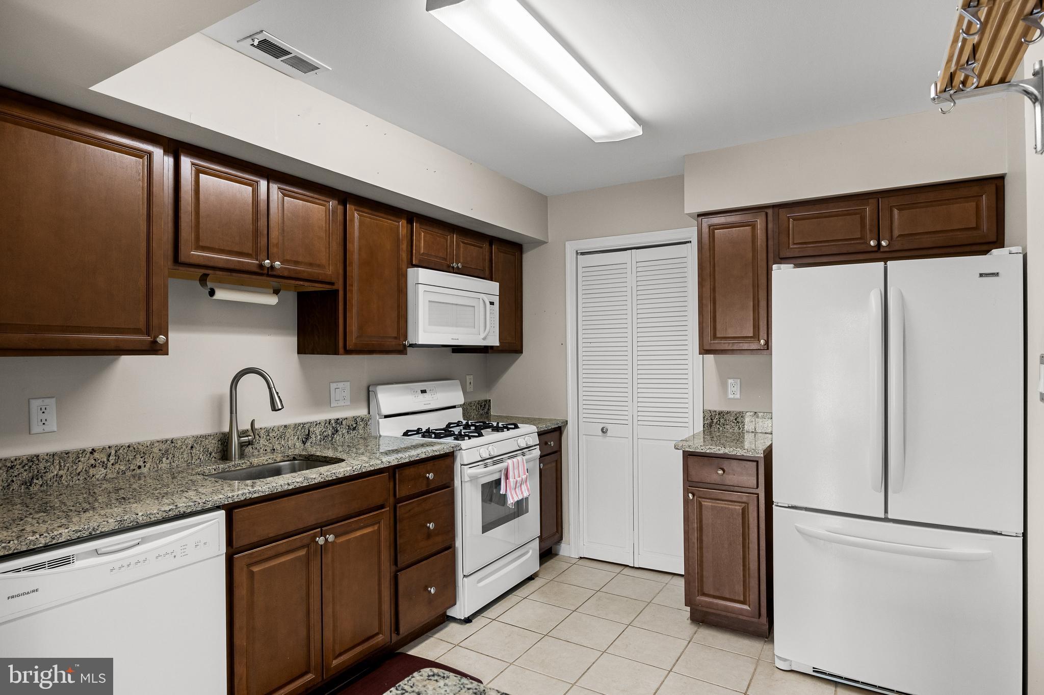 3704 Fenwick Lane Mount Laurel, NJ 08054 - Photo 11 of 26 a kitchen with stainless steel appliances granite countertop a refrigerator sink and stove