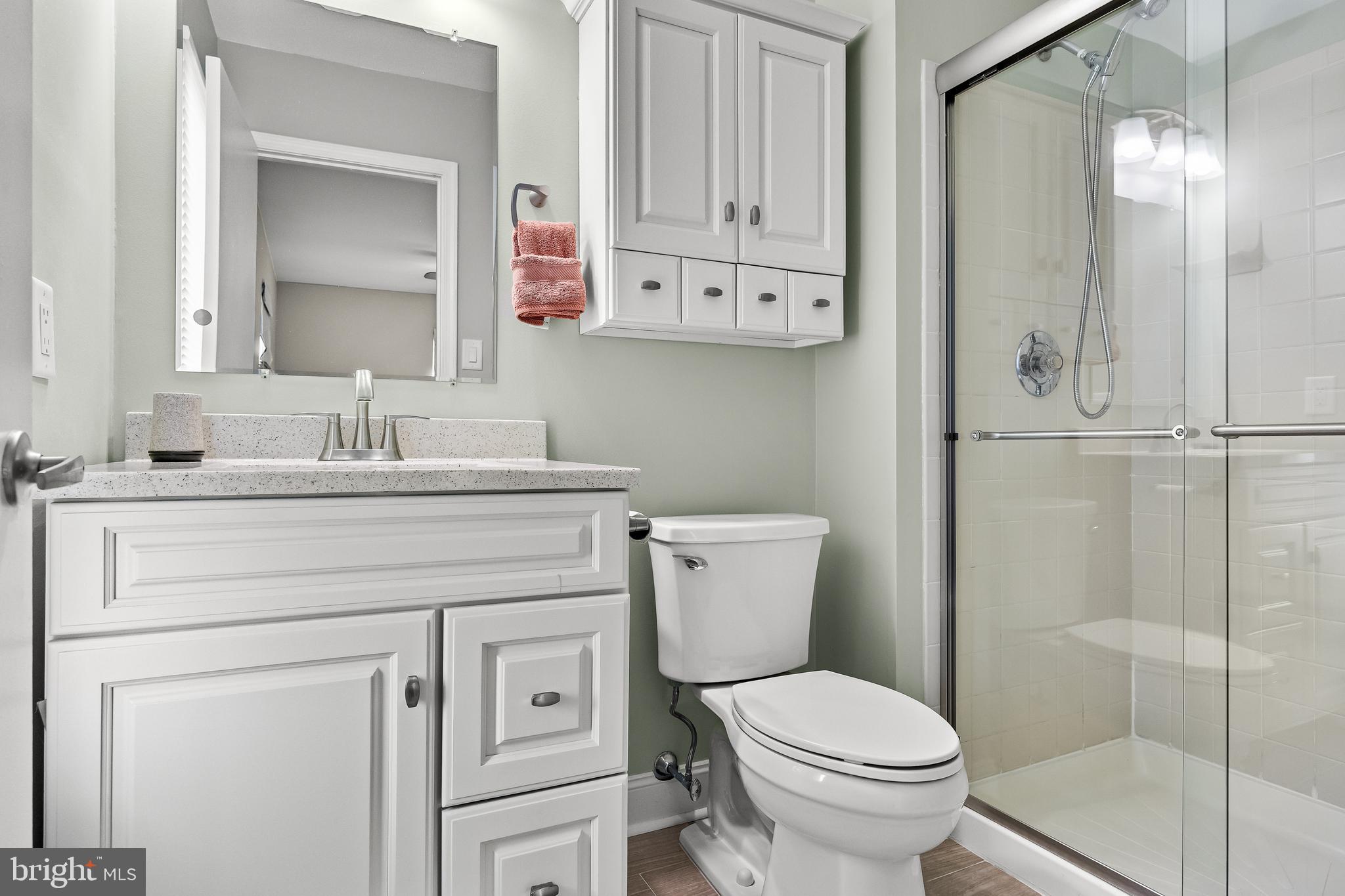 3704 Fenwick Lane Mount Laurel, NJ 08054 - Photo 19 of 26 a bathroom with a toilet sink vanity and mirror