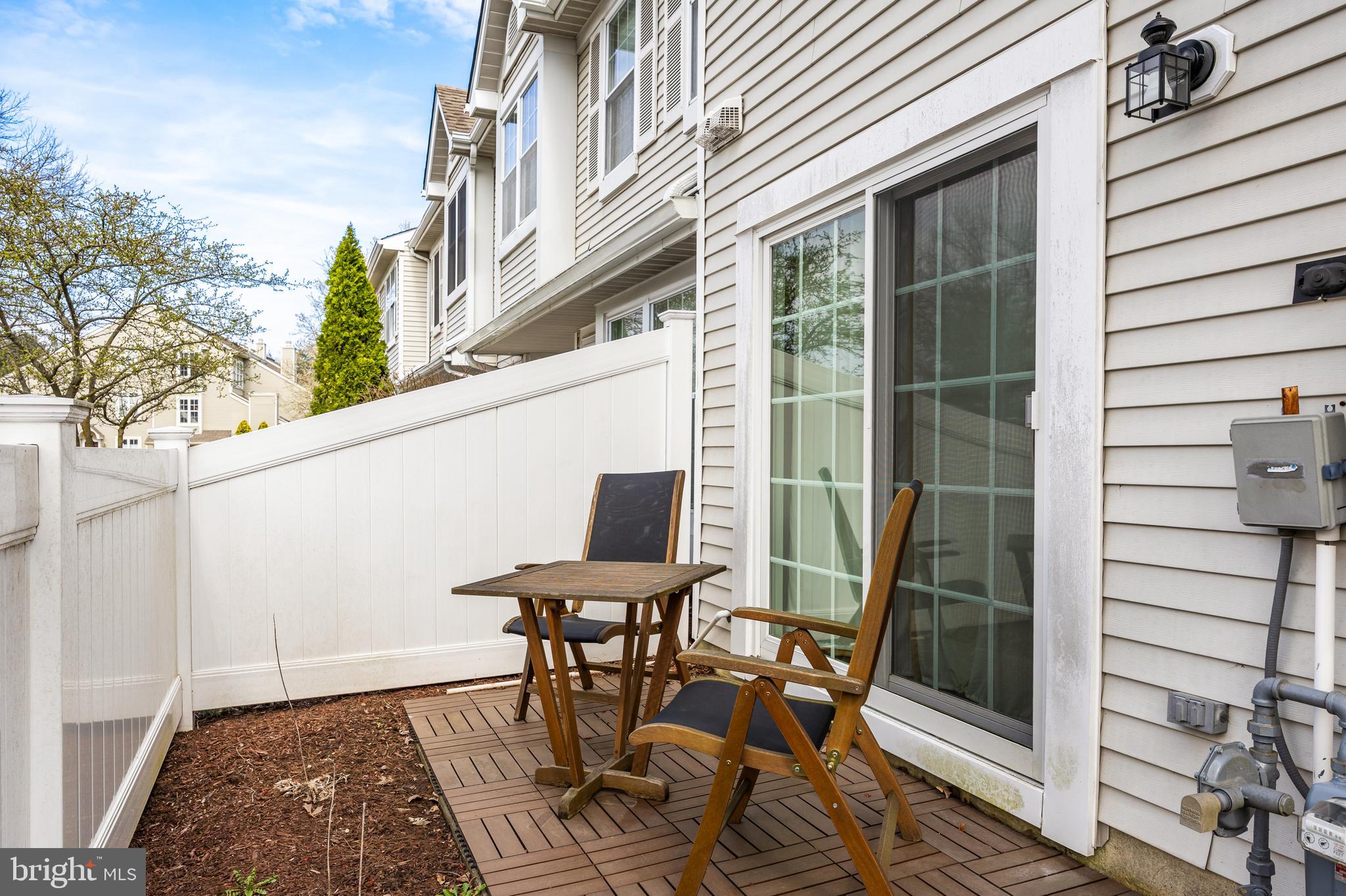 3704 Fenwick Lane Mount Laurel, NJ 08054 - Photo 25 of 26 a view of a patio with table and chairs and wooden floor