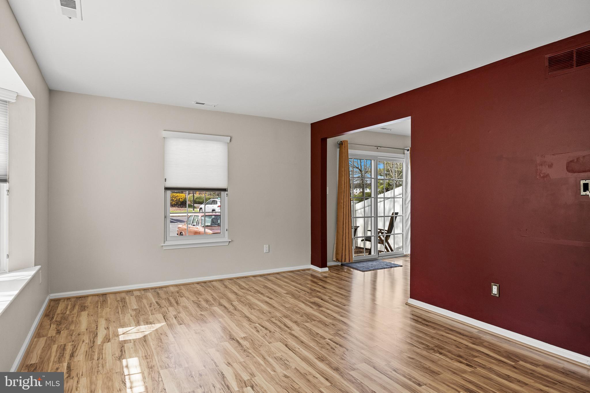 3704 Fenwick Lane Mount Laurel, NJ 08054 - Photo 5 of 26 a view of an empty room with wooden floor and a window