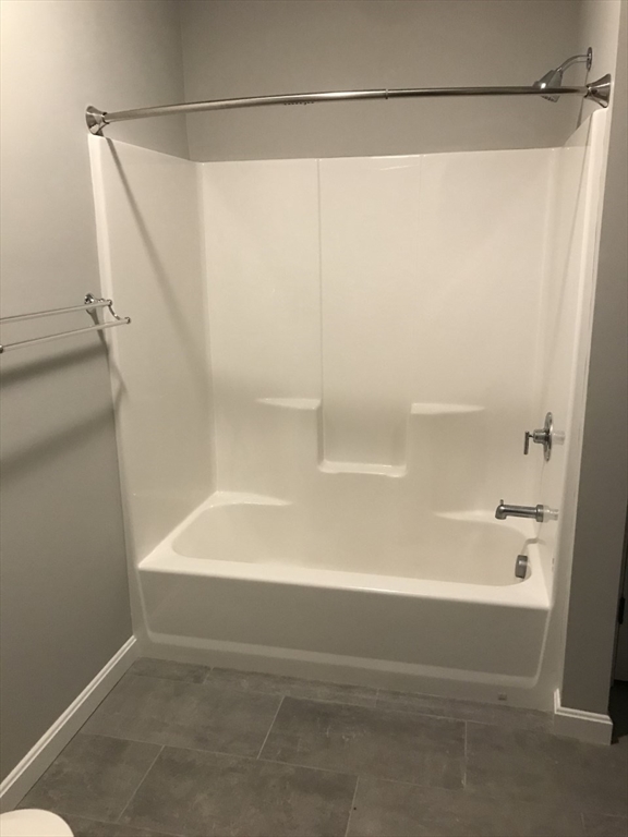 16 Bowdoin Street, Unit 2 Worcester, MA 01609 - Photo 6 of 13 a bathroom with a shower and a bath tub