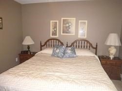 16 Bowdoin Street, Unit 2 Worcester, MA 01609 - Photo 7 of 13 a bedroom with a bed and a lamp