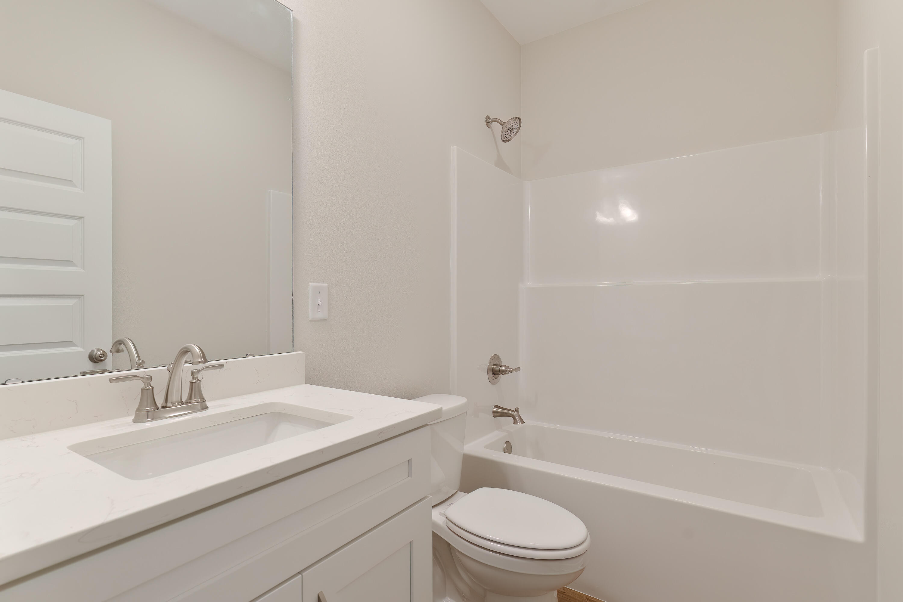 6194 Winstead Cove Crestview, FL 32539 - Photo 12 of 15 a bathroom with a sink a toilet and shower