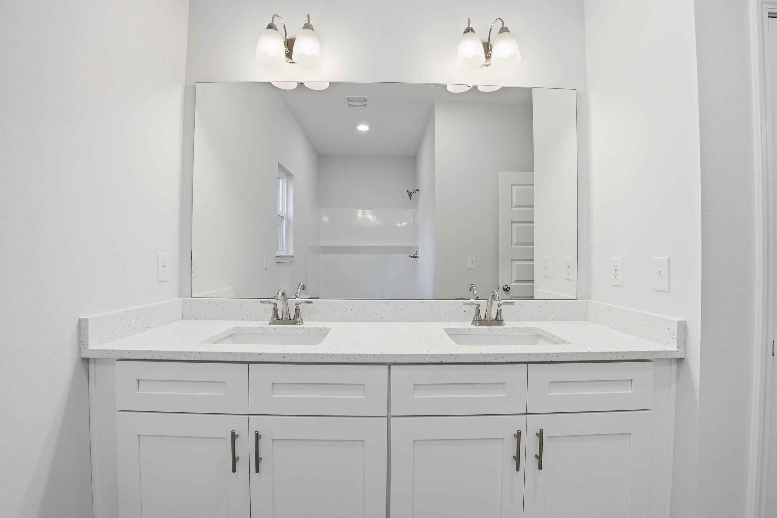 6194 Winstead Cove Crestview, FL 32539 - Photo 9 of 17 a bathroom with a sink vanity and a mirror