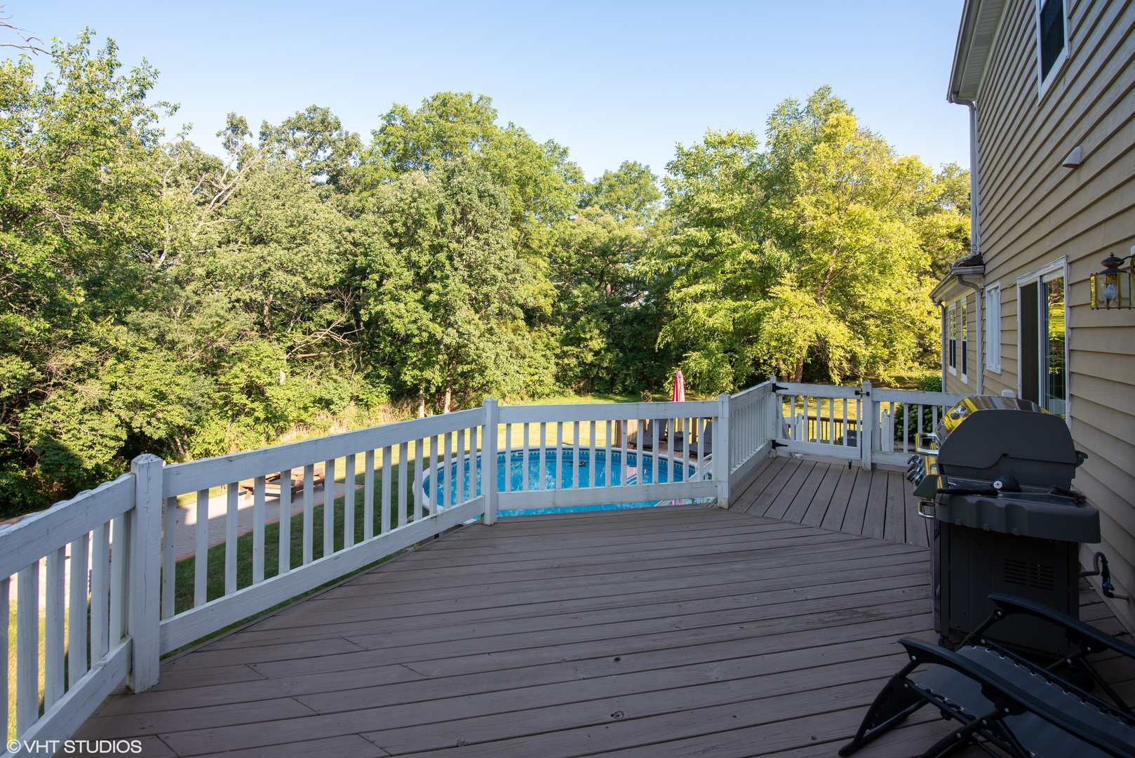 35W521 Parsons Road Dundee, IL 60102 - Photo 17 of 18 a view of a roof deck with table and chairs with wooden floor