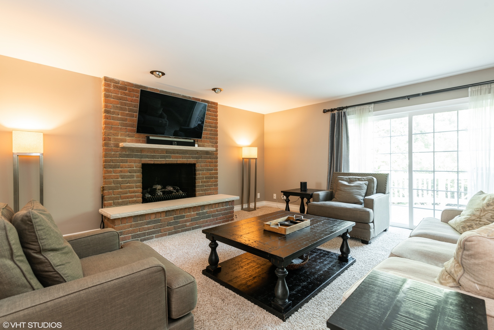 35W521 Parsons Road Dundee, IL 60102 - Photo 7 of 18 a living room with furniture a flat screen tv and a fireplace