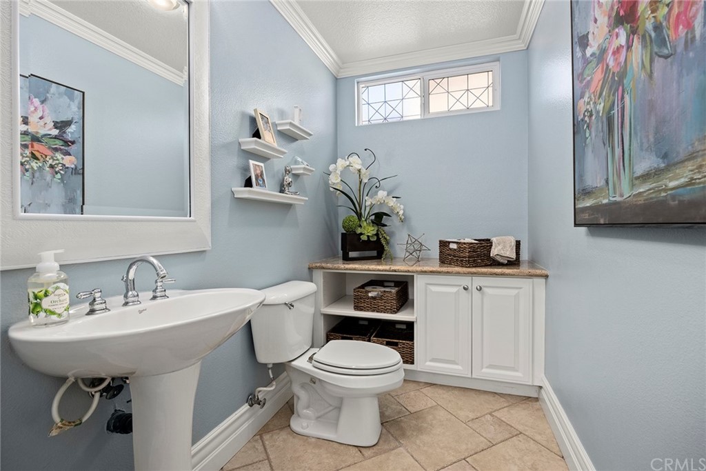 2442 Hawksfield Way Orange, CA 92867 - Photo 15 of 28 a bathroom with a toilet a sink and mirror