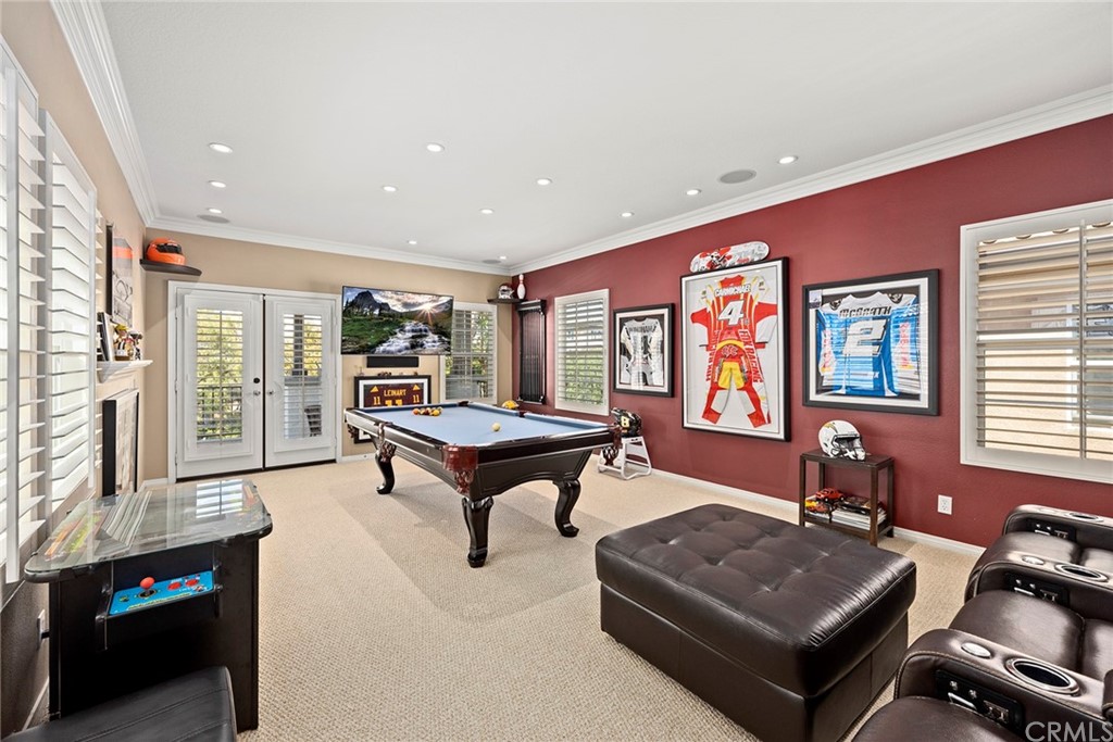 2442 Hawksfield Way Orange, CA 92867 - Photo 22 of 28 a living room with furniture a window and a flat screen tv