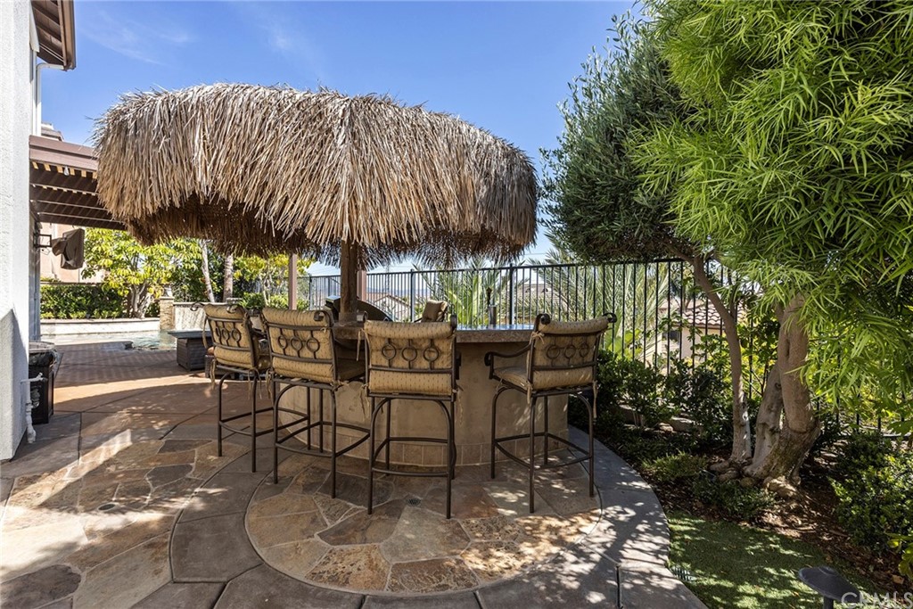 2442 Hawksfield Way Orange, CA 92867 - Photo 26 of 28 a patio with a patio table and chairs